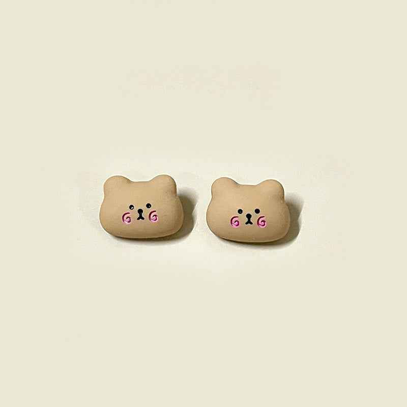 Cartoon brown bear face resin button with pink swirly cheek accents