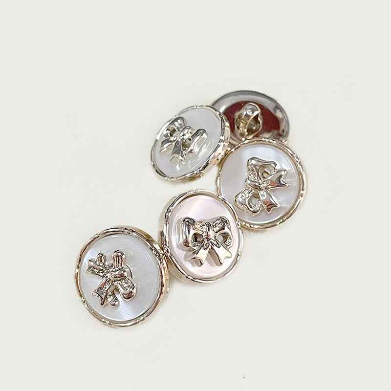 40 round bow plastic buttons, shiny silver-tone finish (4 shown)