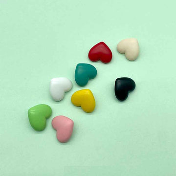 Colorful heart-shaped plastic shank buttons: red, teal, green, yellow, white, pink, black