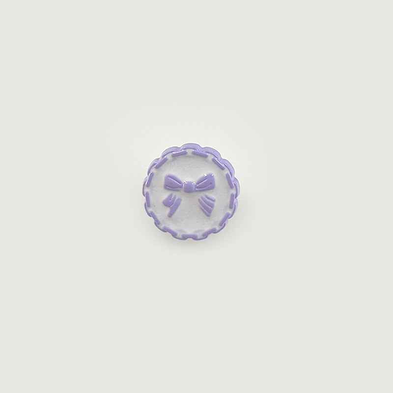 18mm plastic button with chain edge, lavender face, bow detail