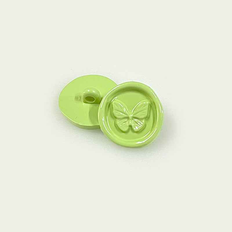 Lime green round plastic shank button pair with butterfly embossed front
