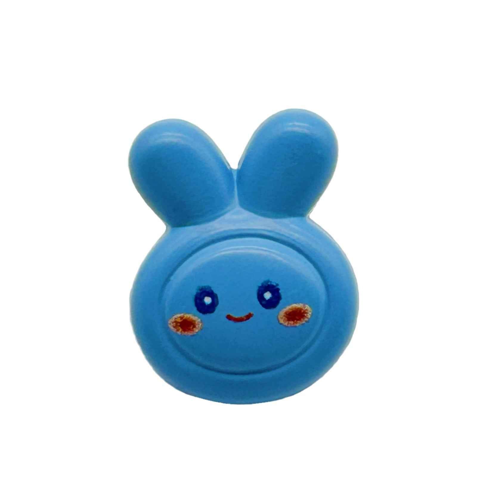 Blue cartoon rabbit button with smiling face, two ears, and central button hole