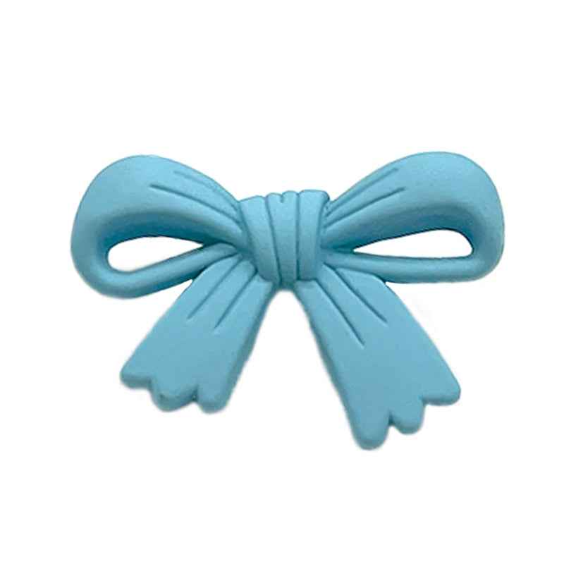 Light-blue 28mm plastic bow button with looped ribbon tails