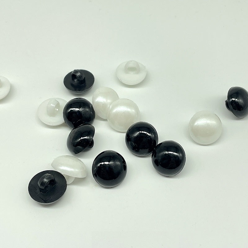 Black and white plastic mushroom buttons with sew-on shanks, 30mm