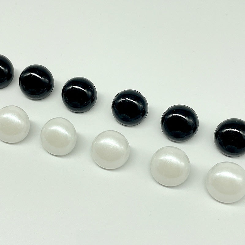 Assorted black and white mushroom buttons with sew-on shanks