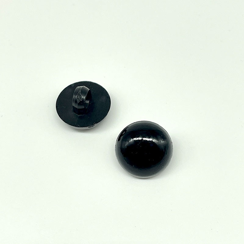 Black plastic mushroom button with visible shank, round sew-on style