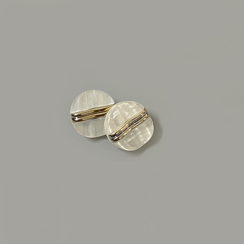 18mm round double-bar resin shank button, pearlized light cream, angled pair