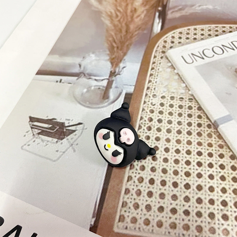 Black cat face plastic button with white muzzle and two pink heart accents