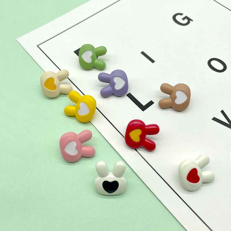 Colorful cartoon bunny plastic buttons with heart faces in green, purple, brown, red, pink, white