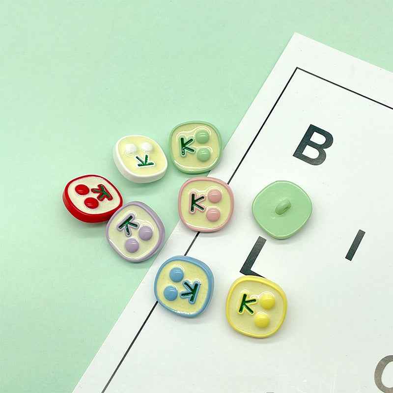 Mixed pastel cherry icon plastic buttons: red, mint, blue, yellow, pink, lavender, lime