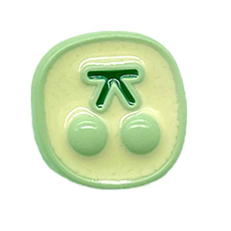 Mint-green cherry button with two glossy green cherry halves and green stem on light base