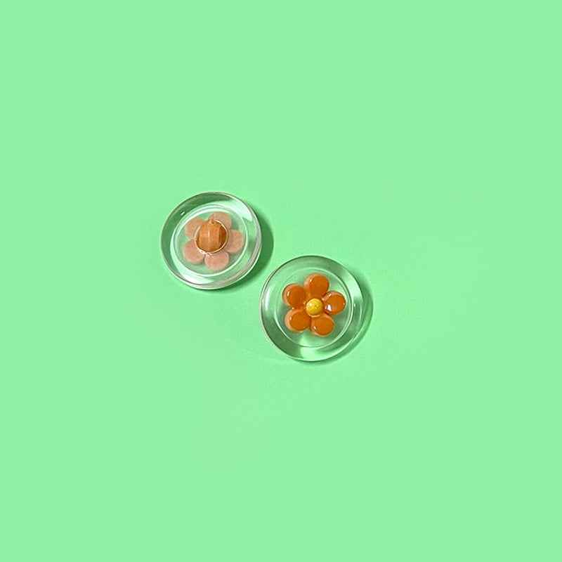 Orange flower transparent plastic shank buttons, round two-tone design (2 shown)