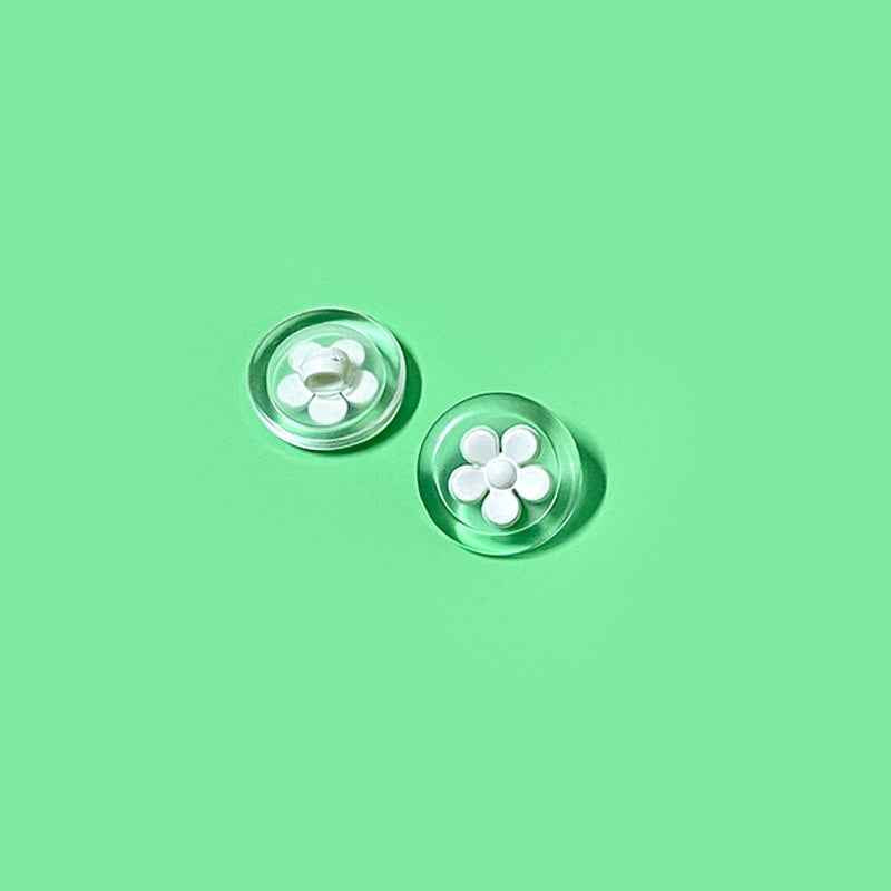White flower transparent plastic shank buttons, round two-tone design (2 shown)