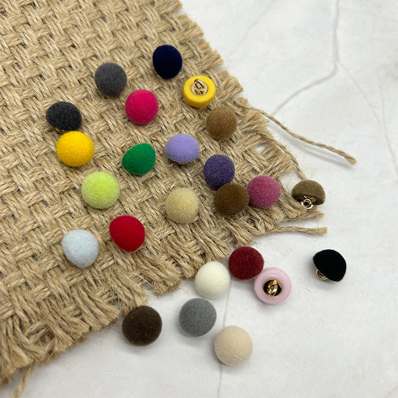 Colorful 10mm flocked mushroom buttons with metal loops, scattered on woven pouch