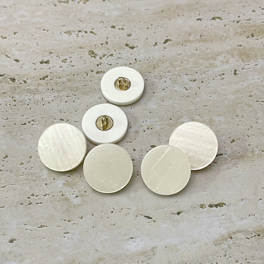 Set of beige flat resin buttons with metal loops on the back