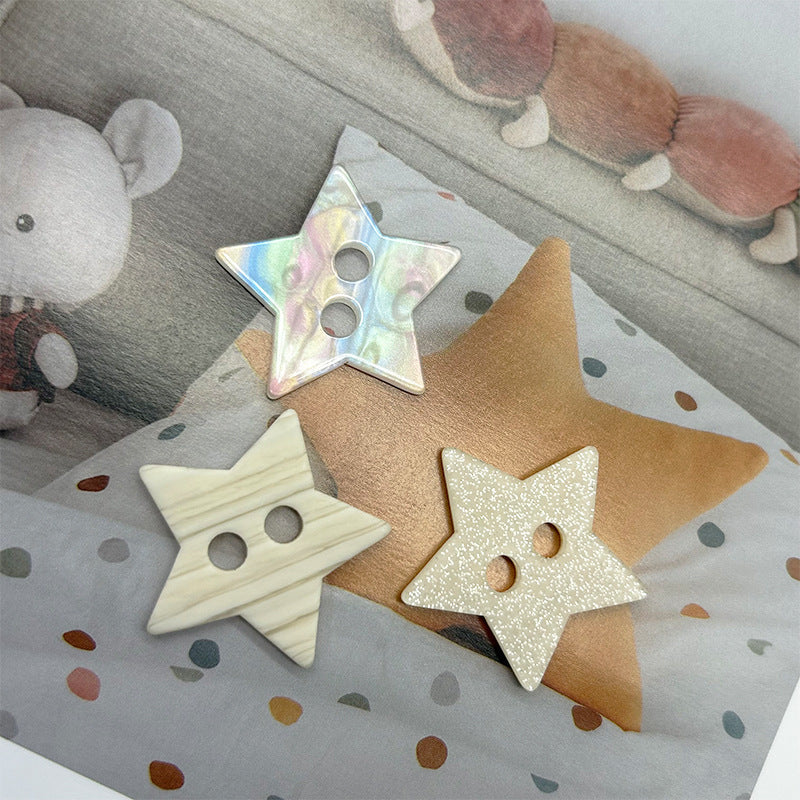 Star-shaped two-hole buttons, iridescent and beige tones, multiple pieces