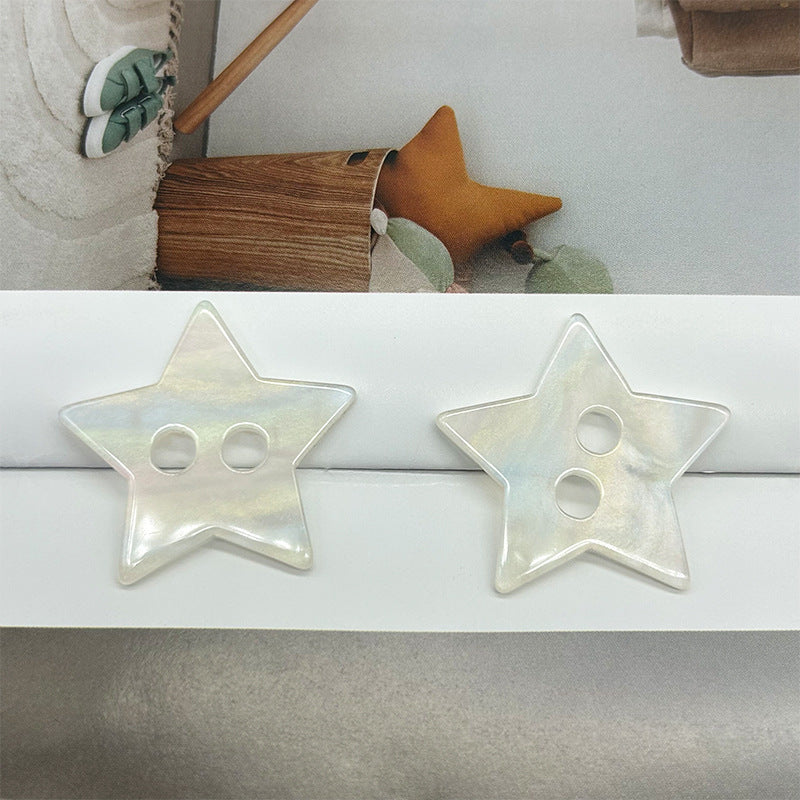 Star-shaped two-hole button pair, iridescent rainbow shell
