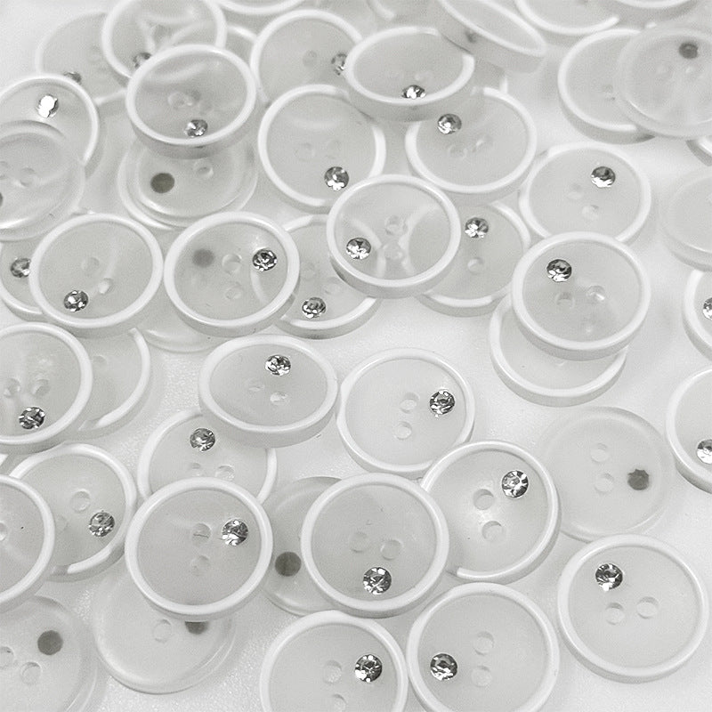 Round white resin buttons with clear rhinestone center and two holes