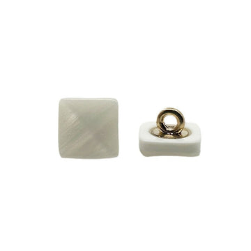 White square pyramid resin shank button with gold-tone loop, side view