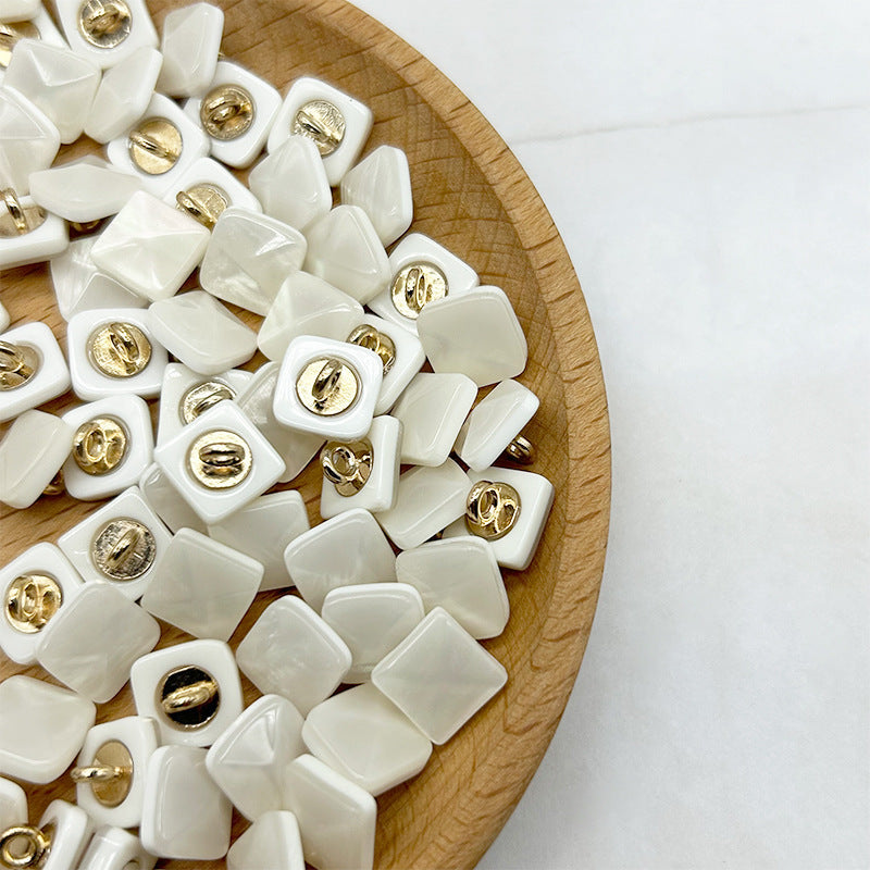 Lotsofbuttons white square pyramid shank buttons with gold-tone loops on white bases