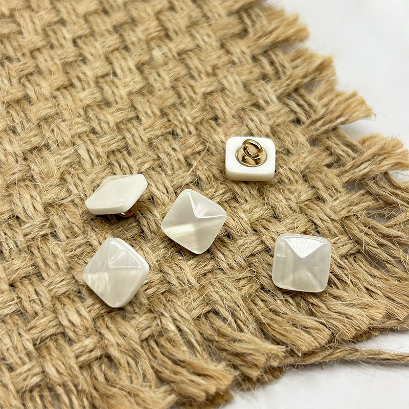 White square pyramid resin shank buttons with gold-tone loops on white bases