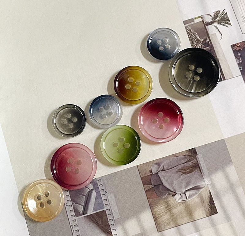 Round gradient resin buttons, four-hole; mixed colors including navy, gold, green, red-pink, gray