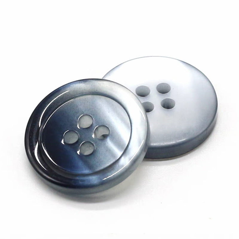 Light gray-and-navy round gradient resin button with four holes, glossy pearlized finish