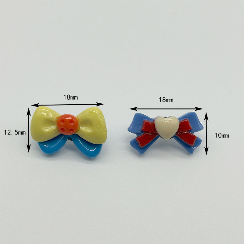 18mm bow resin buttons: front yellow/blue, back blue/red heart; metal shank