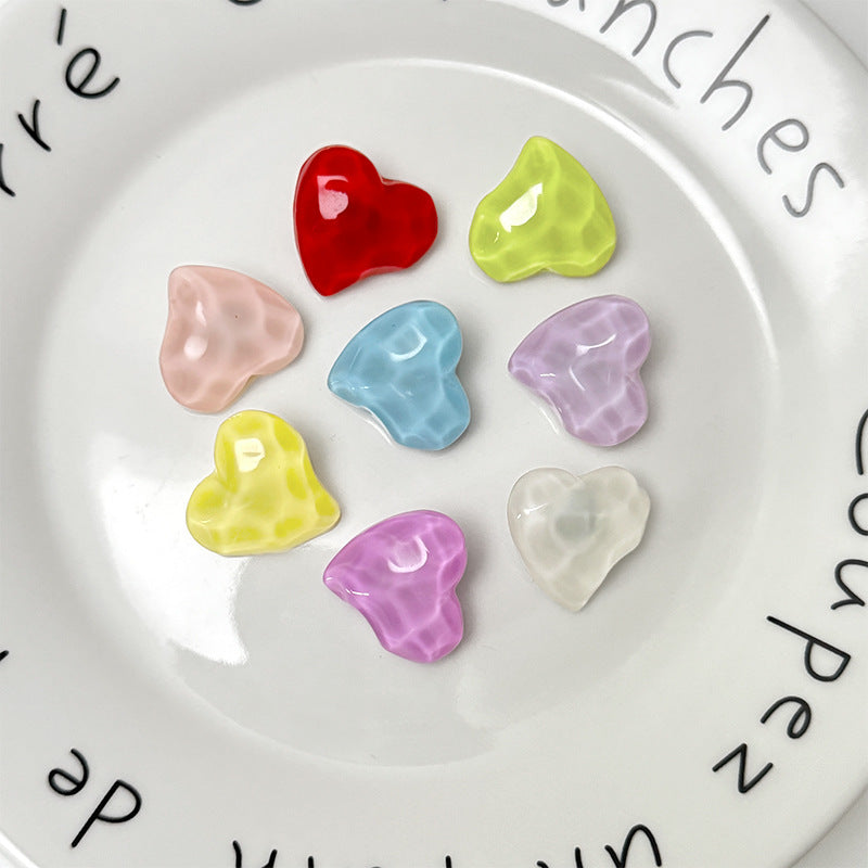 3D heart resin buttons, close-up of red, blue, green, purple, pink and white hearts