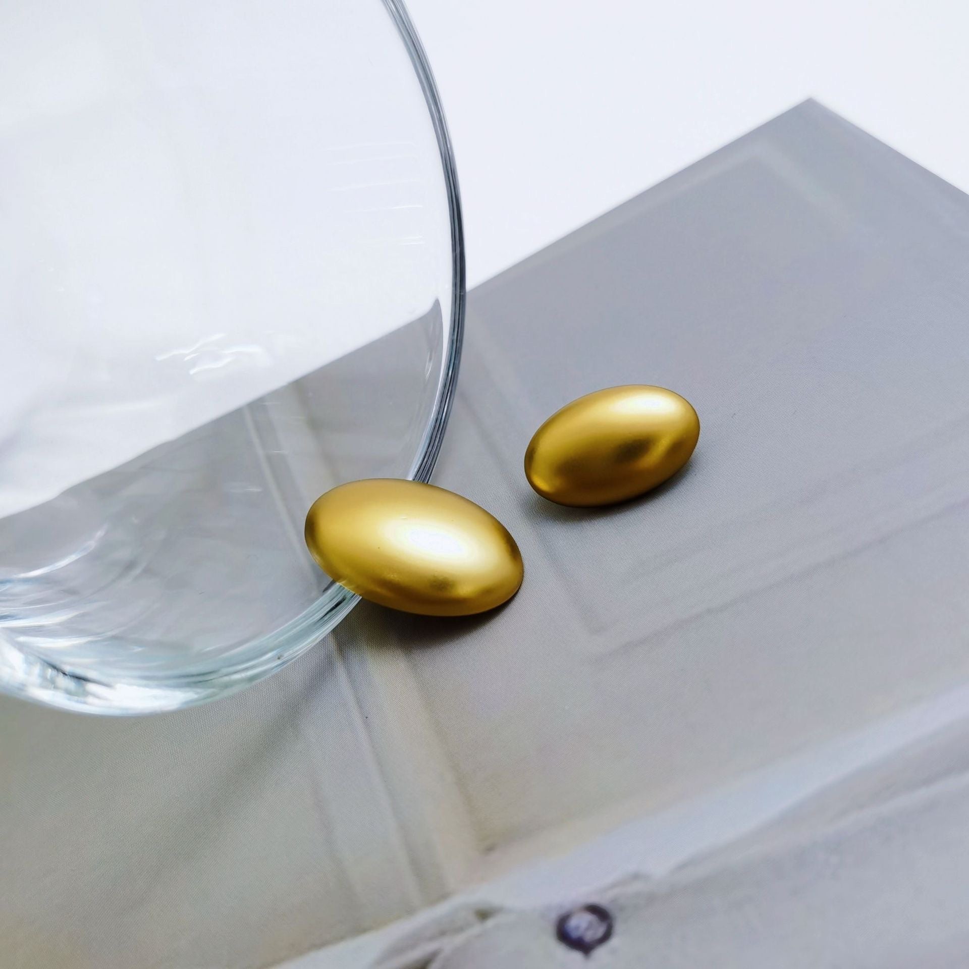 Light gold oval metal buttons with shanks, smooth glossy finish (18/22.5mm)