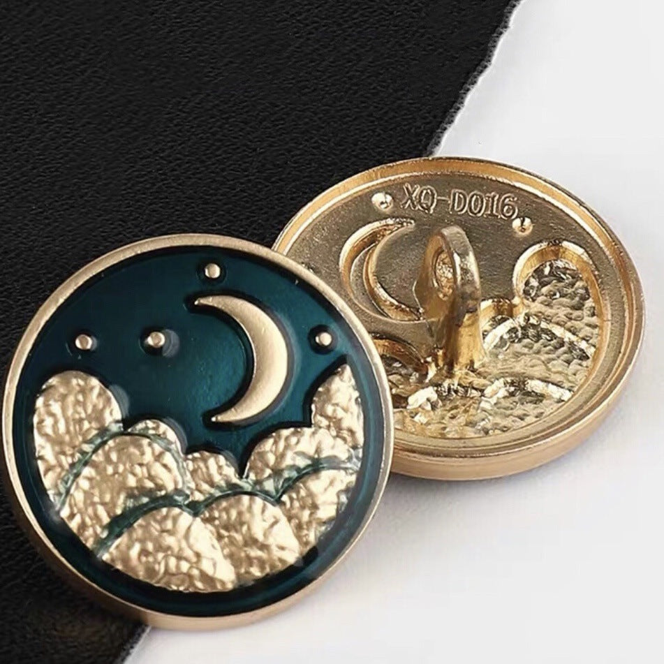 Moon motif sewing button, blue enamel crescent with pearl, gold-tone metal rim, 20mm.