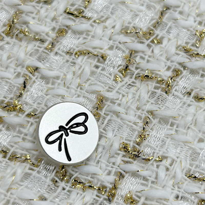 Black bow-knot painted metal flat button with shank, round silver face