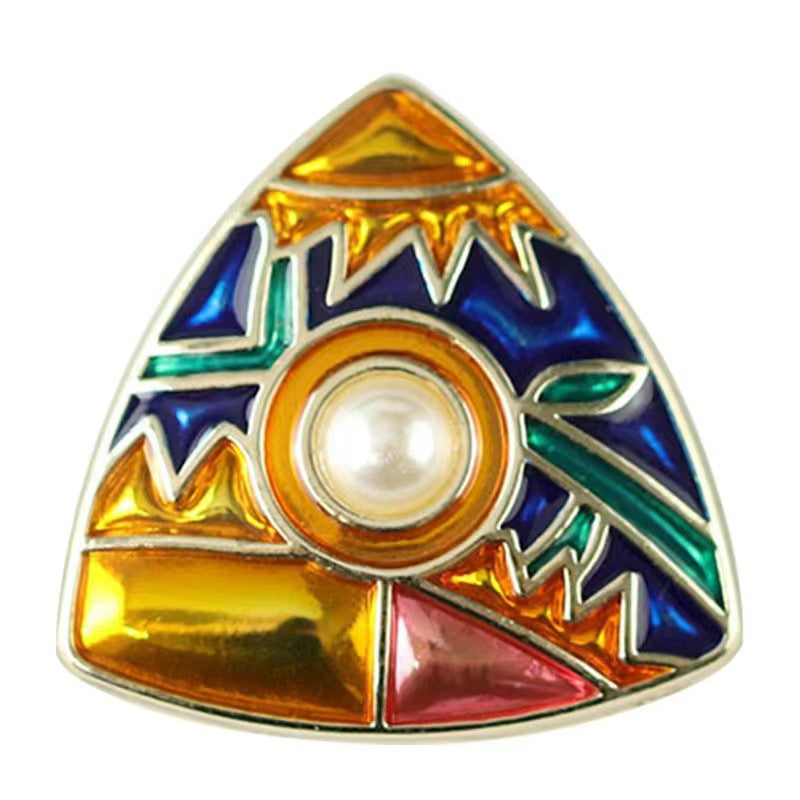 Triangular enamel coat button with gold, blue, green pattern and round pearl-like center