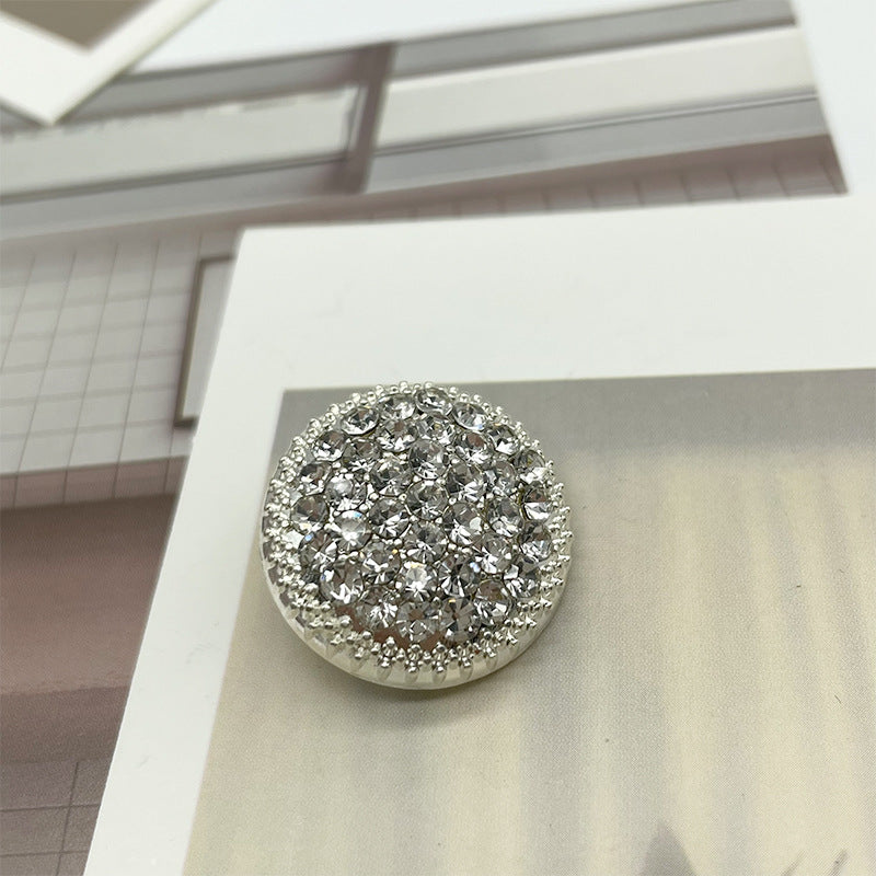 Round rhinestone button with clear crystals and shiny silver border