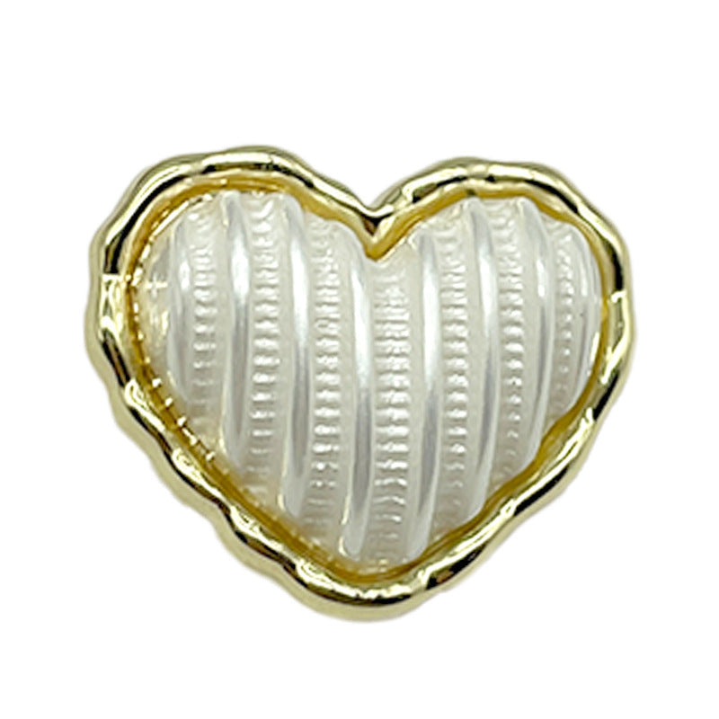 Heart-shaped gold-and-white metal coat buttons with shanks, ribbed white front