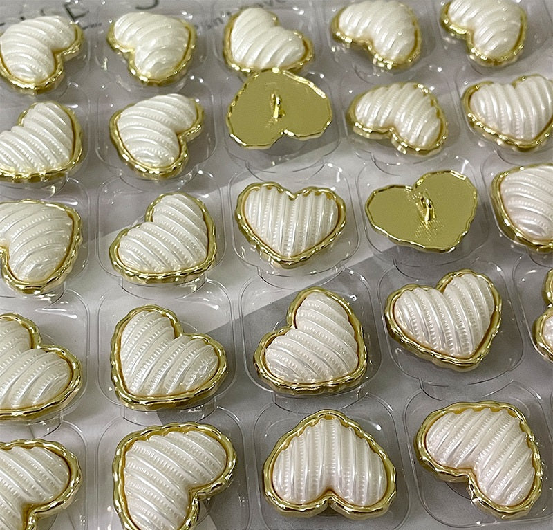 Gold-and-white love-heart alloy buttons with shanks, multiple pieces with ribbed faces