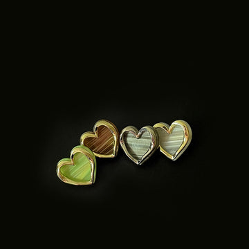 Heart-shaped dual-tone metal buttons with shanks, green centers and gold rims (3 shown)