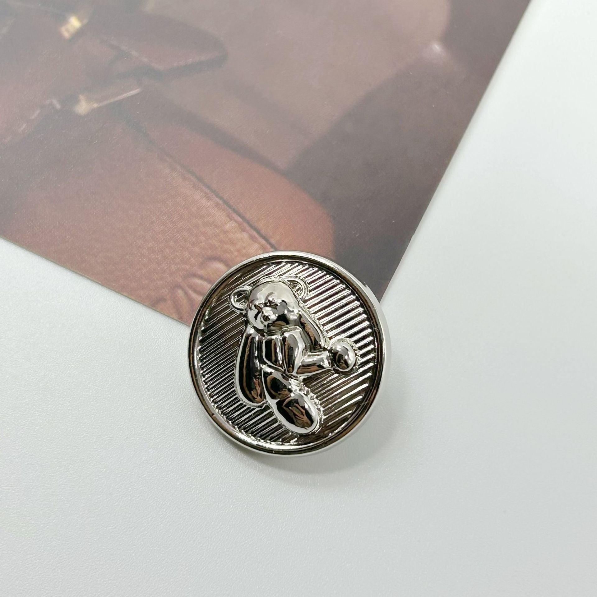 Silver teddy bear decorative metal button with attached shank, round 3D bear detail