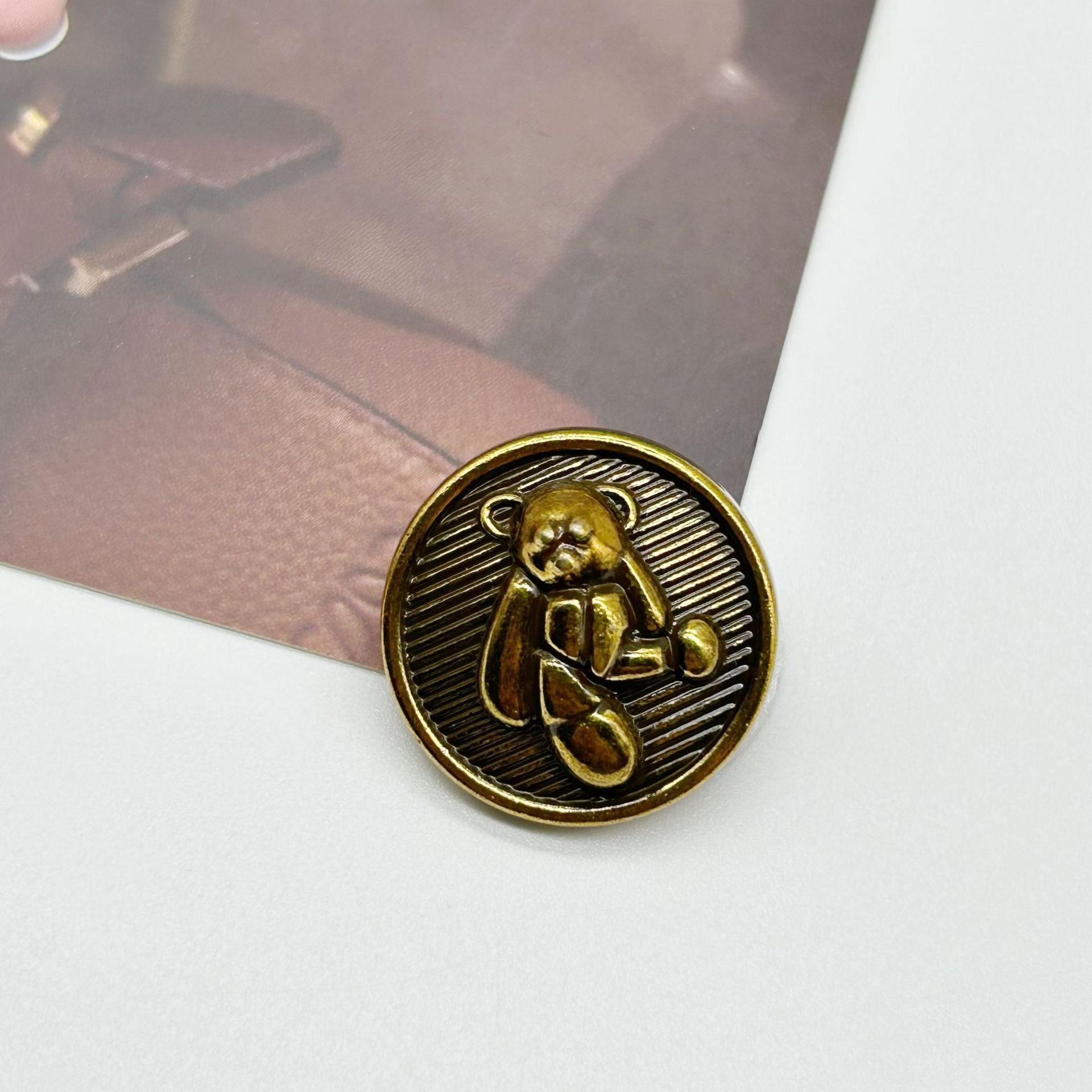 Antique gold teddy bear decorative metal button with shank, dark striped round backplate