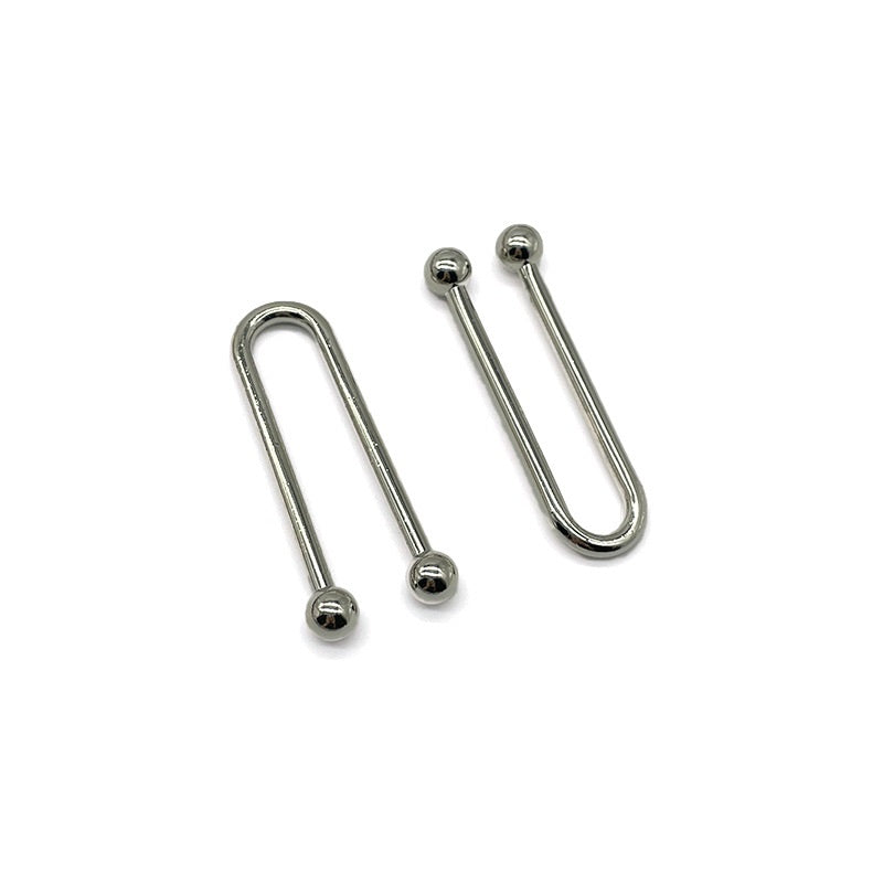 Two U-shaped metal swimwear hook clasps with ball ends, polished finish