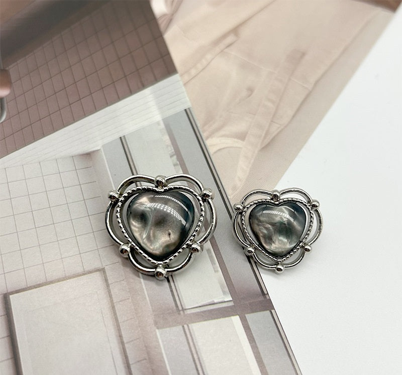 Silver-tone heart-shaped resin buttons with dark center and scalloped metal ring