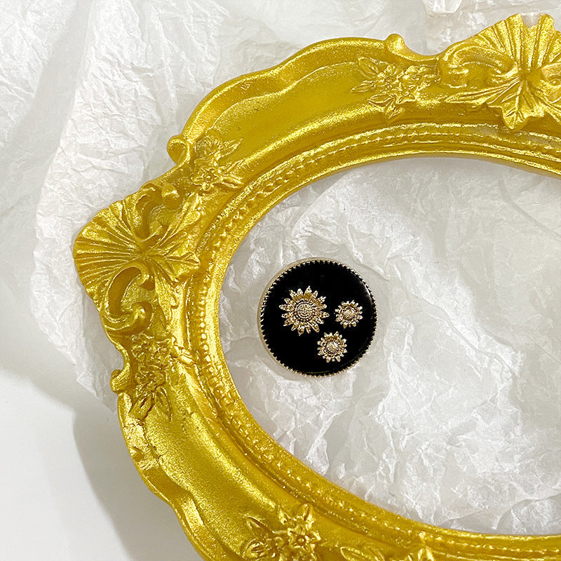 Black sunflower metal shank button with gold painted flower cluster on round face