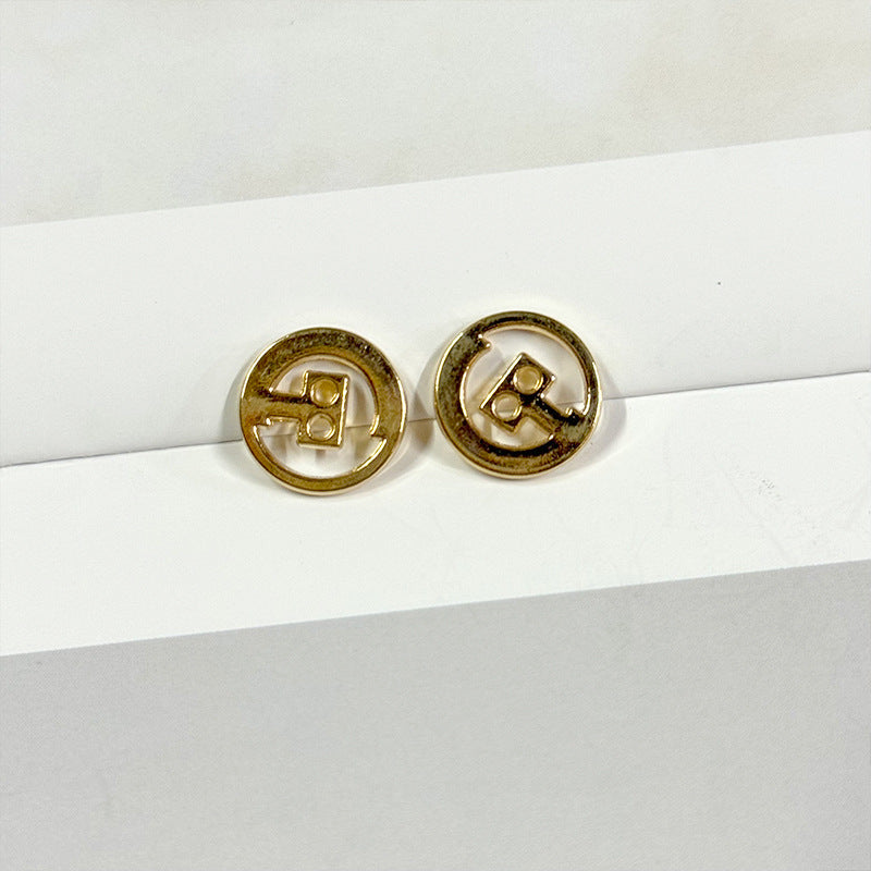 Two 12.5/15mm hollow two-hole metal buttons, gold tone