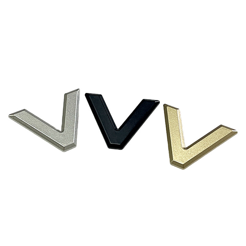 Metal V-shaped two-prong buttons in silver, black, and gold colors