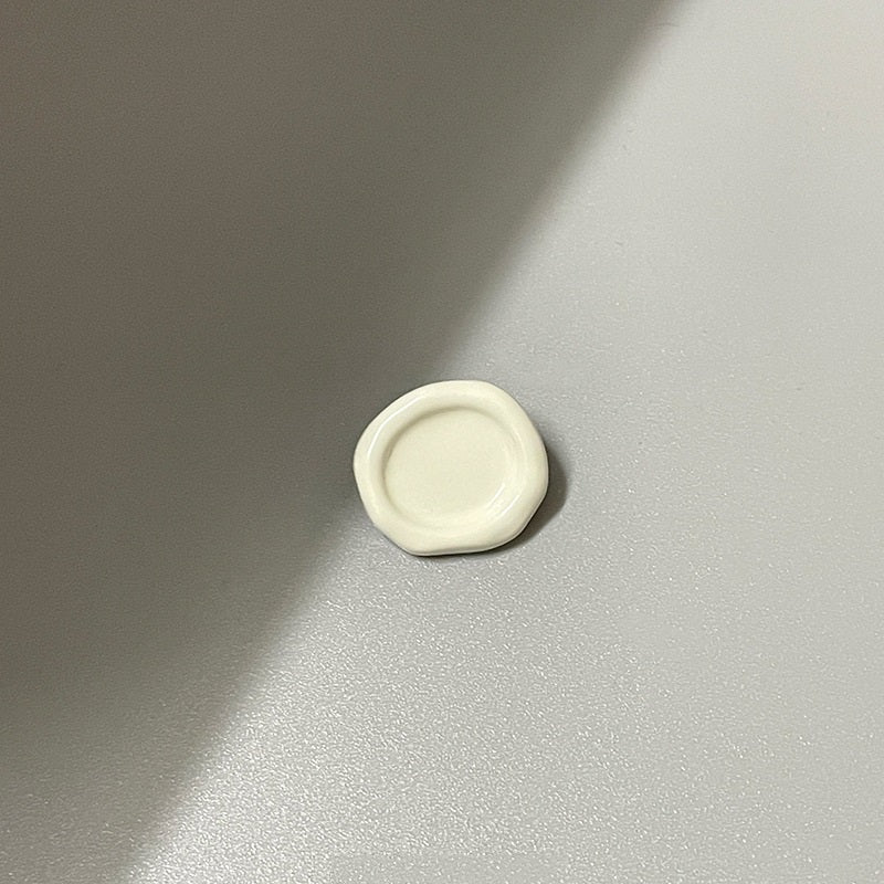 White oval concave metal shank button (back view), 20mm
