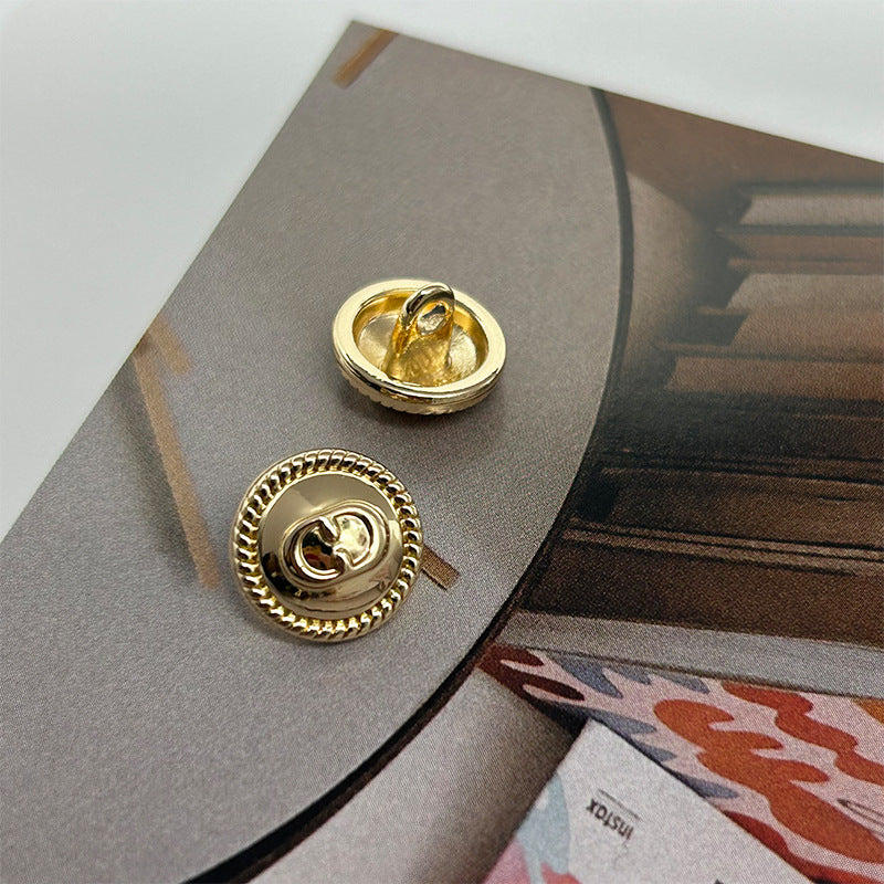 Two 12mm gold-tone double-D metal buttons with shanks for shirts and sweaters