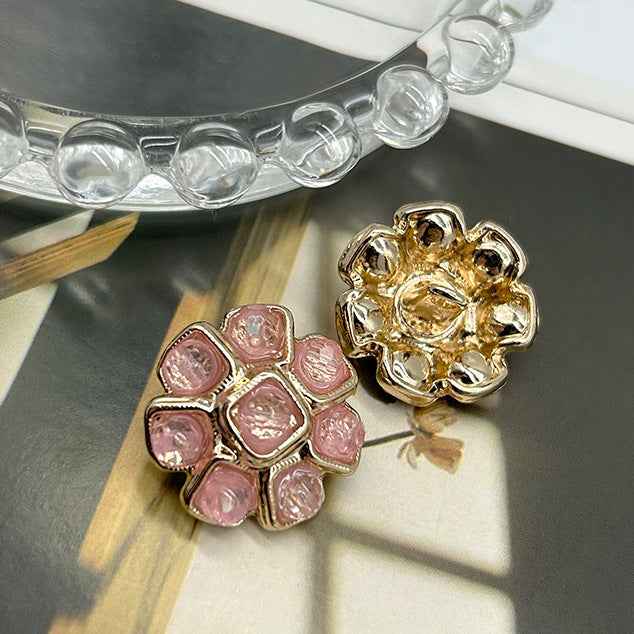 Pink crystal flower metal button with gold-tone frame and faceted square crystals