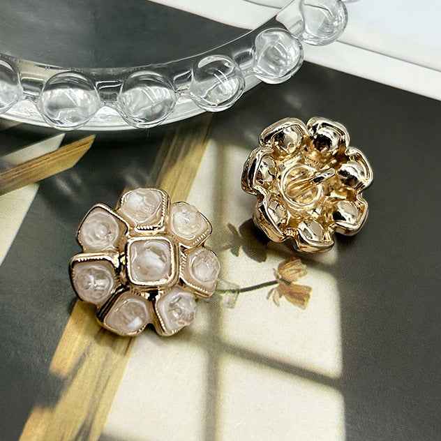 White crystal flower metal button with gold-tone frame and square crystals