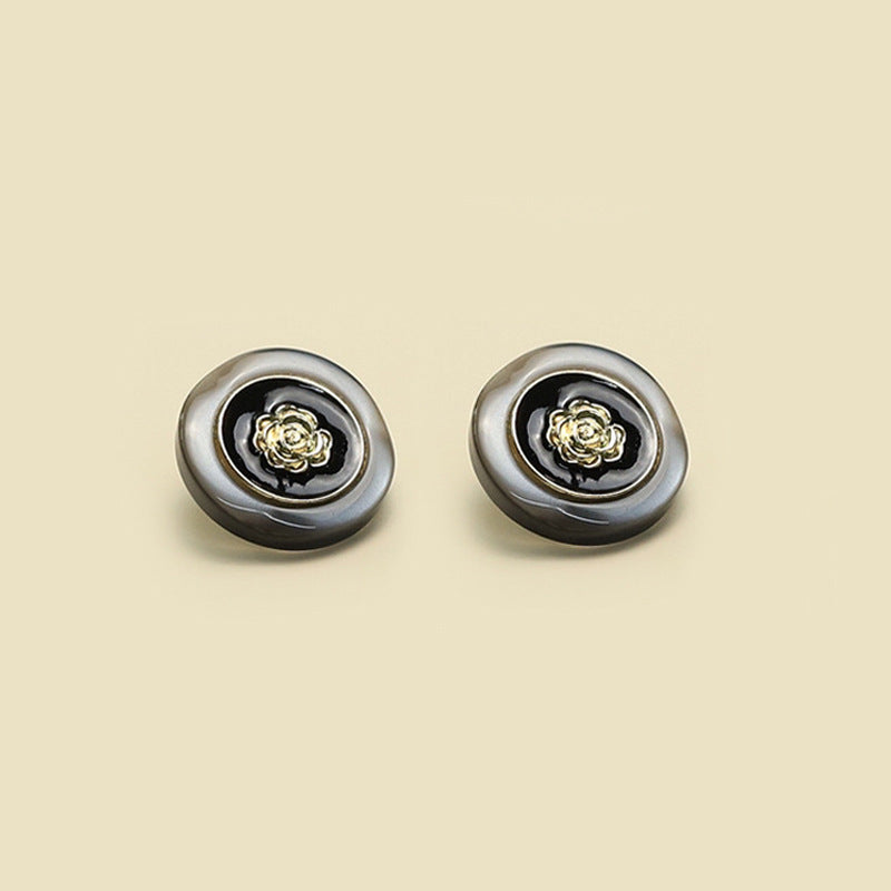 Camellia buttons, two sizes shown (18mm and 23mm), dark resin with gold-tone centers