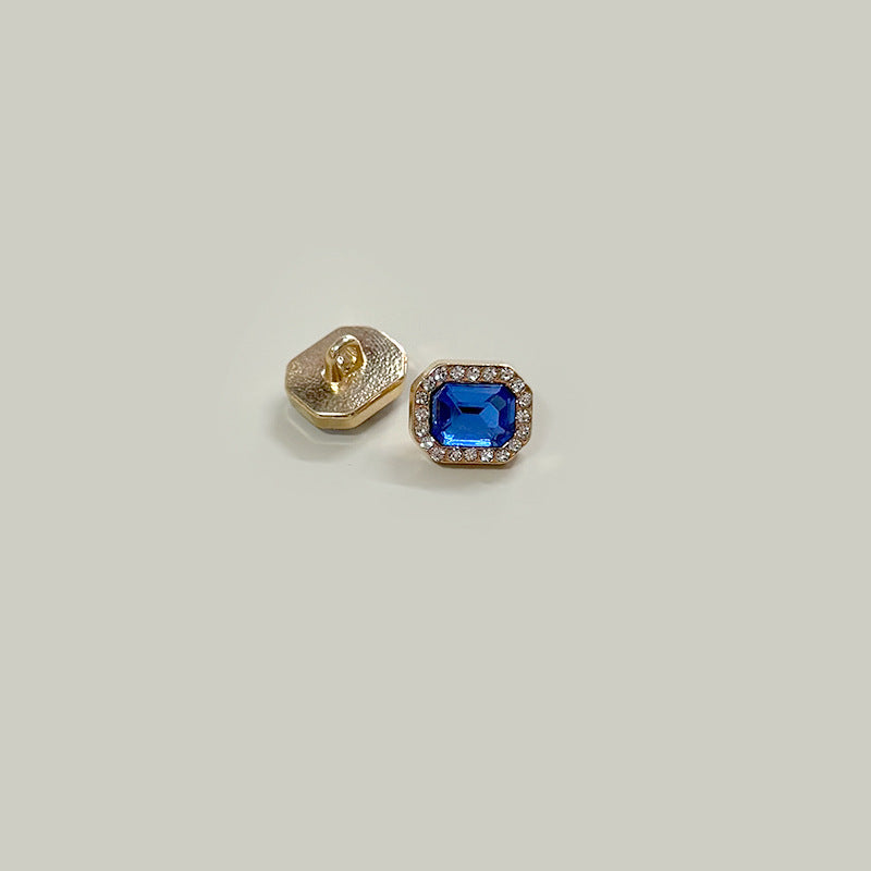Square gem buttons, gold-tone metal with vivid blue center stone, shirt cuff set